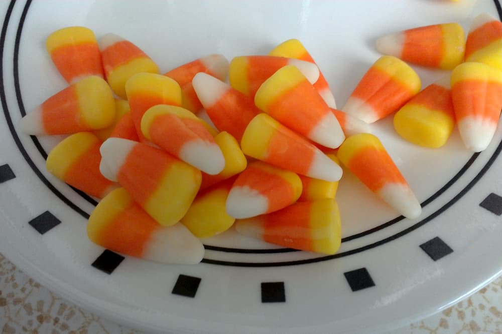 Plate with candy corn on it.